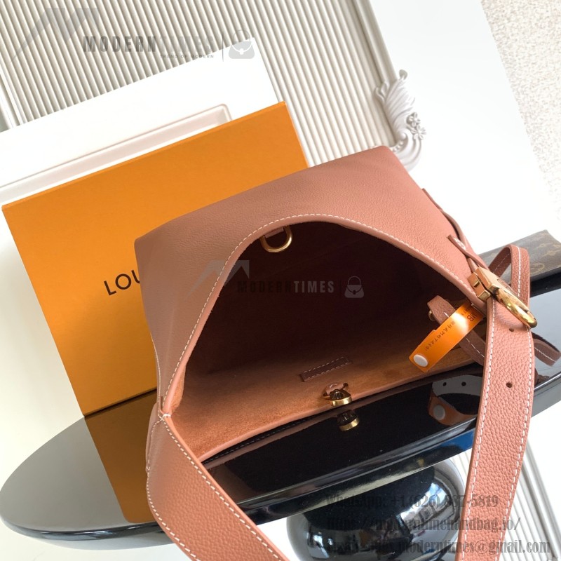 Louis Vuitton Low Key Hobo Bag in grained calfskin leather with adjustable shoulder strap