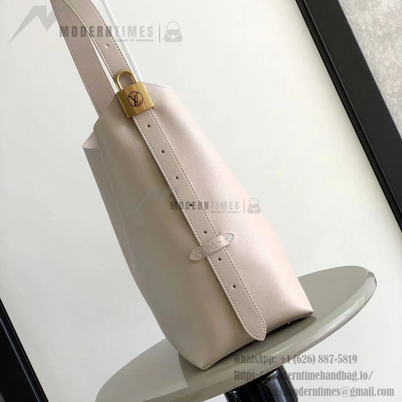 Louis Vuitton Low Key Hobo Bag in grained calfskin leather with adjustable shoulder strap