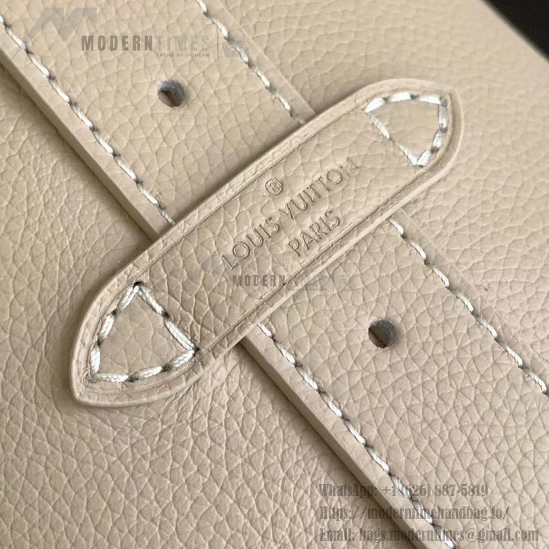 Louis Vuitton Low Key Hobo Bag in grained calfskin leather with adjustable shoulder strap