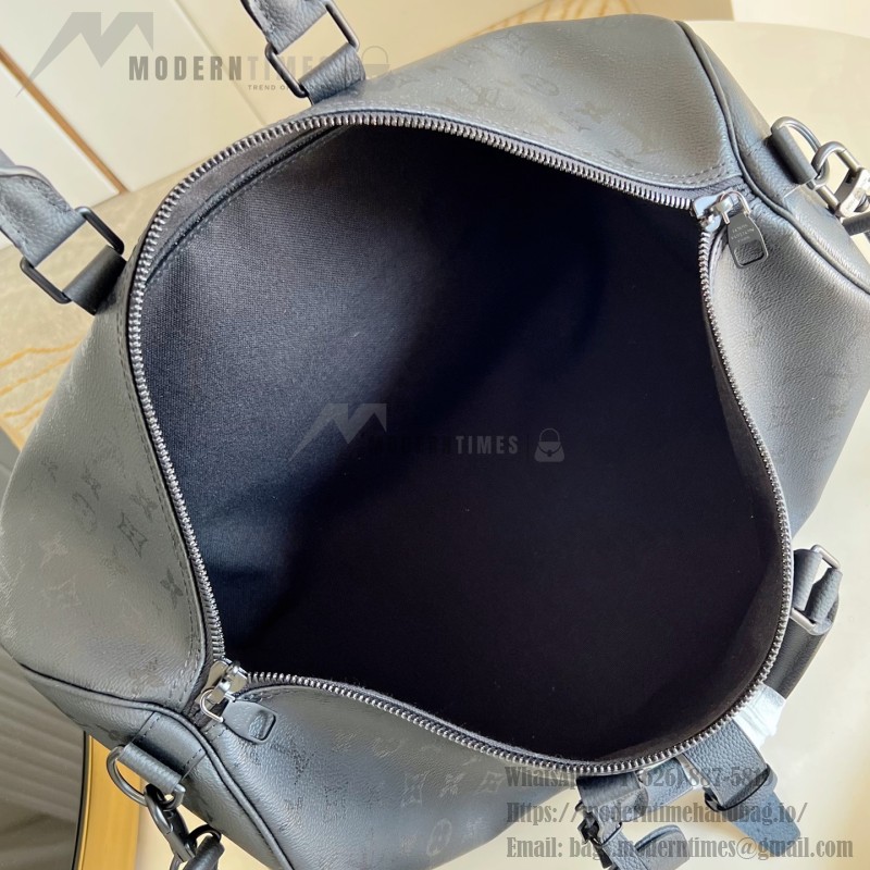Louis Vuitton Keepall Bandoulière 45 travel bag in Monogram Midnight coated canvas with leather trim