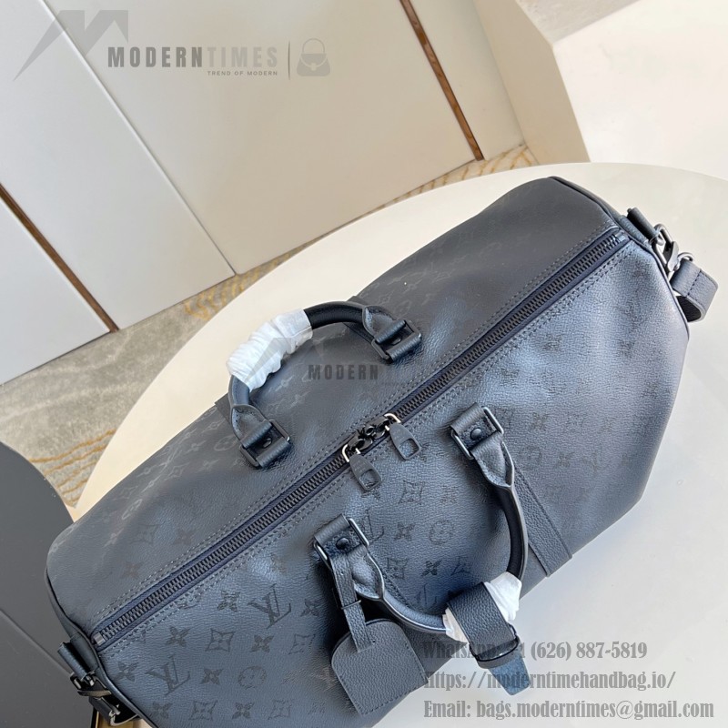 Louis Vuitton Keepall Bandoulière 45 travel bag in Monogram Midnight coated canvas with leather trim