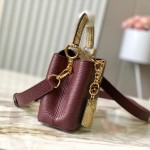 Louis Vuitton Capucines Bag in Burgundy with Golden Snake Handle and Monogram Chain