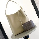 Louis Vuitton Low Key Hobo Bag in grained calfskin leather with adjustable shoulder strap