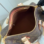 Louis Vuitton Speedy Bandoulière 25 Handbag with Monogram Canvas and Leather Handle