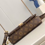 Louis Vuitton Pochette Métis Handbag with Monogram Canvas and polished S-lock closure