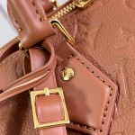 Louis Vuitton Speedy Soft 30 Handbag with Monogram Empreinte Leather and Suede Lining