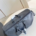 Louis Vuitton Keepall Bandoulière 45 travel bag in Monogram Midnight coated canvas with leather trim