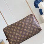 Louis Vuitton Speedy Soft 30 Monogram Anniversary handbag in Monogram canvas with leather trim and travel-inspired accessories